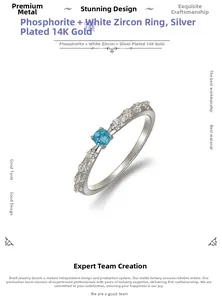 Detail of S925 silver ring with blue apatite stone and 14K gold plated thorn design