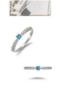 Detail of S925 silver thorn rose ring with blue apatite gemstone and side zircon accents