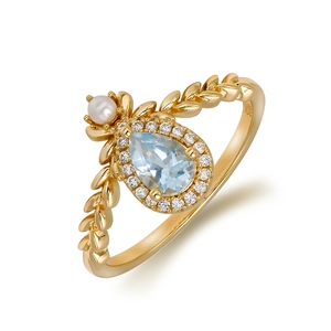 Elegant 925 silver gold ring with pear-cut blue topaz, pearl, and leaf texture