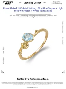 Detail of S925 silver 14K gold ring with sky blue topaz and citrine gemstones