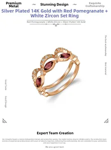 Makro-Detail von vergoldeten Silberringen mit Granat im Marquise-Schliff und Zirkon