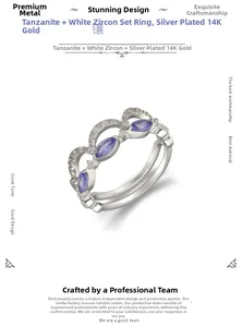 Detail eines 14K vergoldeten Silberring-Sets mit lila Tansanit und Zirkonia-Verzierung
