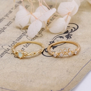Macro shot of 14K gold plated opal rings with vintage crown design and opal stone