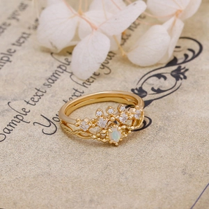 Macro view of French vintage crown ring with oval opal stone and crystal zirconias