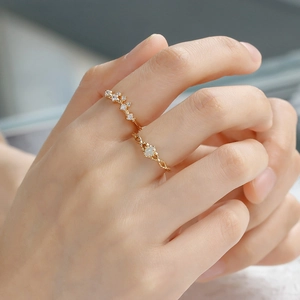 Detail of 14K gold S925 silver rings set with oval opal and sparkling small zircon stones