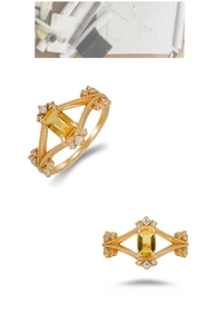 Detail of vintage 14k gold plated ring featuring a rectangular yellow gemstone and filigree