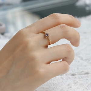 Detailed view of an S925 silver 14K gold plated vintage ring with tanzanite gemstone