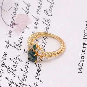 Close-up of S925 sterling silver stamp on the gold-plated moss agate ring band