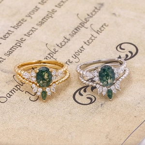 Close-up of vintage S925 silver 14K gold plated moss agate rings with zircon details