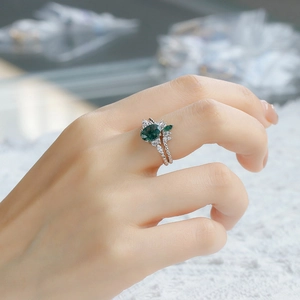 Macro detail of S925 silver ring set with moss agate and white zircon stones