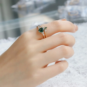 Detail of S925 silver 14K gold plated ring set with green moss agate and white zircon
