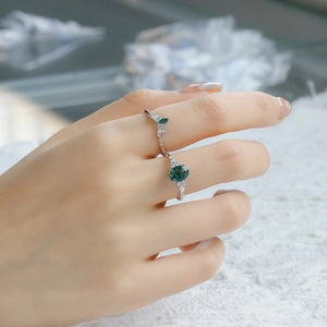 Detailed view of S925 silver rings set featuring green agate and sparkling crystals