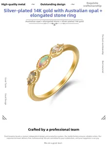 Macro shot of 14K gold plated silver ring with marquise opal and labradorite stones