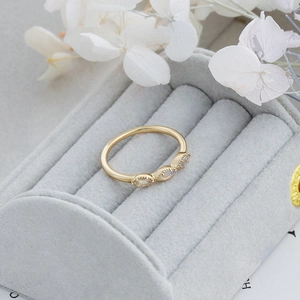 Close-up of vintage gold sterling silver ring with three marquise opal stones in a box