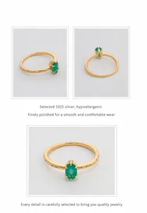 Detail view of oval green chalcedony ring with vintage engravings on S925 silver band