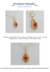 Detail of S925 silver gold-plated pendant with orange garnet and leaf engraving