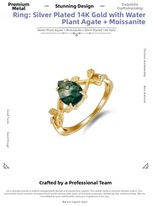 Close-up of moss agate ring with vine-shaped silver band and pear-cut gemstone