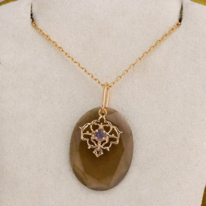 Vintage S925 zilveren ketting met rookkwarts hanger en gouden kanten details