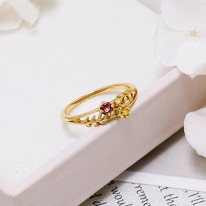 Macro shot of S925 hallmark on gold-plated silver ring with red and yellow gemstones