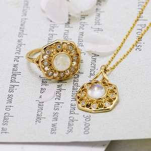 Vintage gold filigree jewelry set with moonstone and cubic zirconia ring and necklace
