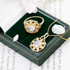 Close-up of S925 sterling silver stamp on vintage moonstone ring and pendant set