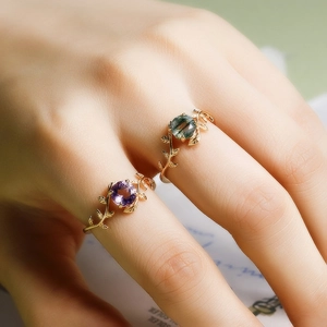 Detailed close-up of S925 silver gold-plated vine leaf rings with amethyst and moss agate