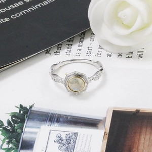 Close-up of S925 silver labradorite ring with vintage hollow carvings and floral details
