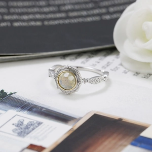 Macro view of vintage 925 silver ring with octagonal grey gemstone and floral engraving