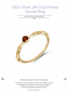 Macro view of S925 sterling silver ring with natural red garnet and ribbon edge detailing