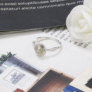 Detailed macro view of vintage S925 silver ring featuring labradorite and floral engravings