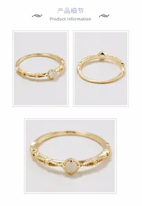 Detail view of gold-plated S925 silver ring featuring vintage embossed texture and gemstone