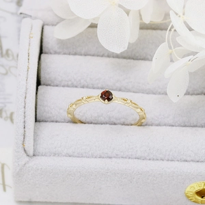 Detailed macro view of gold-plated S925 silver ring featuring vintage engraved textures