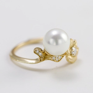 Elegant lotus shell pearl ring with moissanite accents in a luxurious vintage gold setting