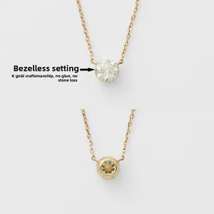 Detail of K-gold bezel setting on gold necklace showing secure stone placement