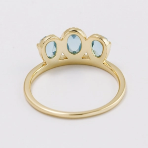 Retro S925 silver gold-plated ring featuring three oval light blue rose-cut stones