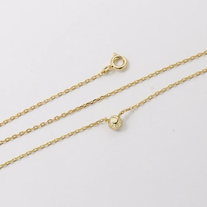 Minimalist 925 silver necklace with single moissanite pendant on a gold O-chain