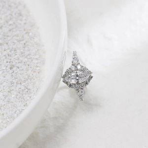 Macro detail of marquise-cut halo engagement ring with sparkling stones in S925 silver