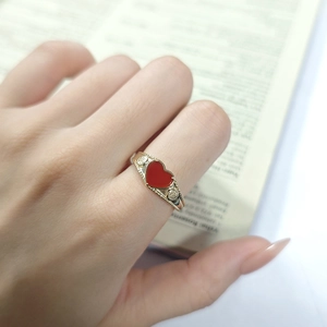 Detailed view of S925 silver gold-plated ring with red heart agate and vintage textures