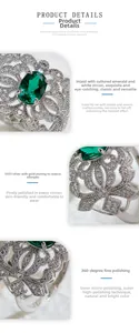 Detail of vintage sterling silver ring with oval lab emerald and hollow floral setting