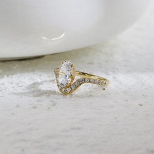 S925 sterling silver gold plated ring with oval gemstone and wavy pavé setting