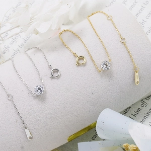 Detail of S925 sterling silver bracelets with round zircon stones in gold and silver
