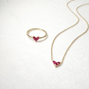 Elegant S925 silver gold plated jewelry set featuring red heart-shaped gemstone pendant and ring