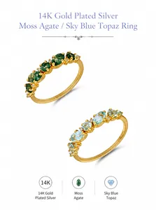 Detail of 14K gold plated silver rings with moss agate and sky blue topaz gemstones