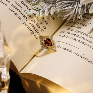 Vintage palace style gold plated silver ring with pear shaped red garnet gemstone