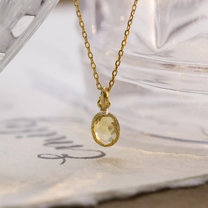 Elegante collana in argento sterling dorato con citrino e ciondolo a trama fogliare