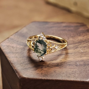 Detail of a vintage gold-plated ring with hexagonal moss agate and tiny cubic zirconia