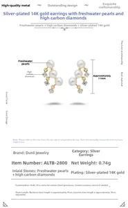 Detail of 14K gold plated silver earrings with freshwater pearls and carbon diamonds