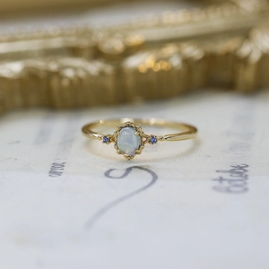 Vintage S925 silver gold-plated ring with oval aquamarine and blue accent stones