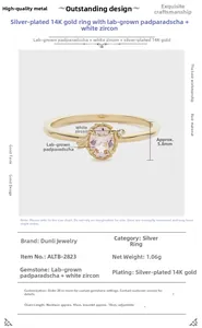 Detail view of 14K gold plated silver ring with oval pink padparadscha stone and white zircon