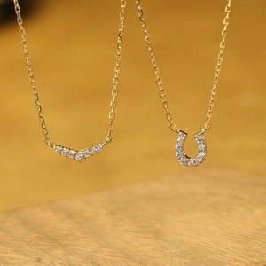 Minimalist gold plated sterling silver V-shape and horseshoe necklace with pavé zircon stones